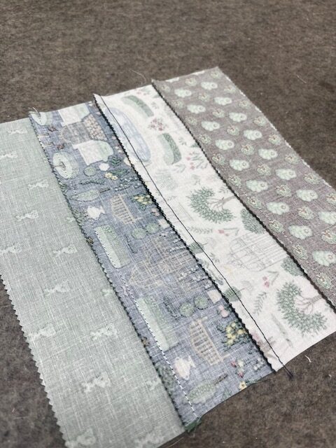 Pressed seams shown all going in the same direction to reduce bulk in Emma’s Garden quilt blocks.